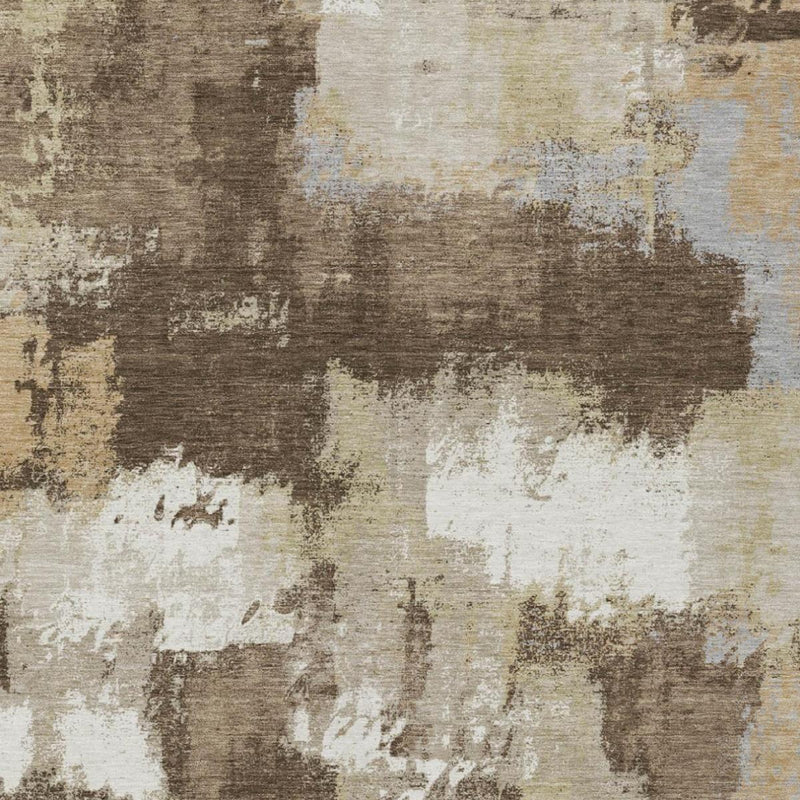 Close-up abstract rug texture with dark brown, tan, and cream faded block design