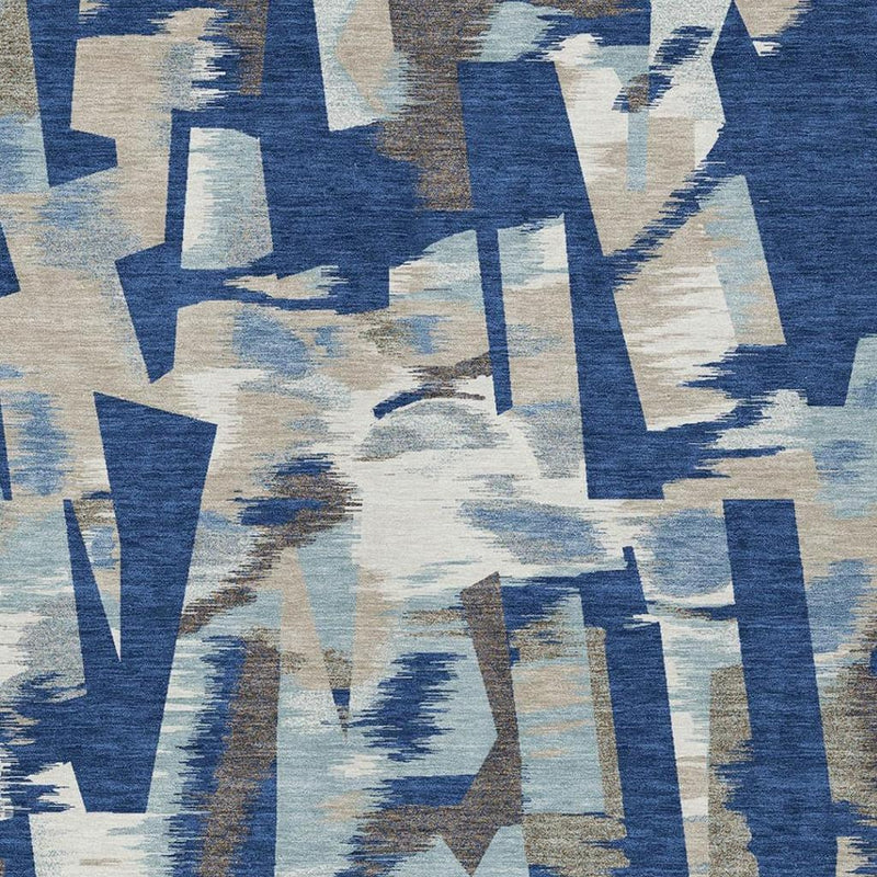 Washable abstract area rug pattern in blue, beige, and neutral tan strokes
