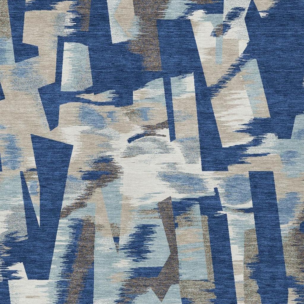 Close view of washable abstract area rug with blue and beige geometric design