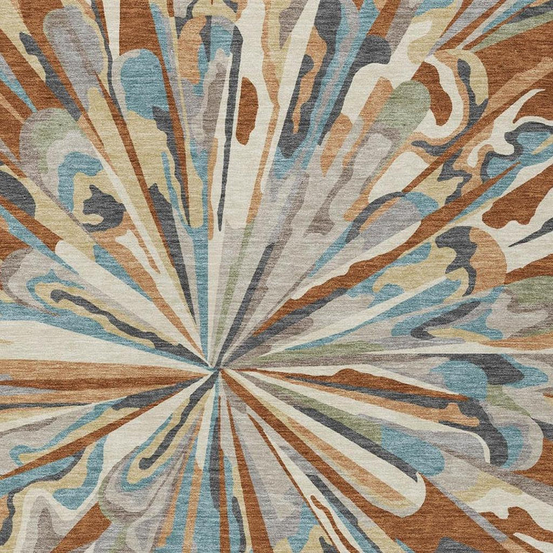 Colorful abstract area rug featuring radial burst pattern in teal, orange, gray, and beige