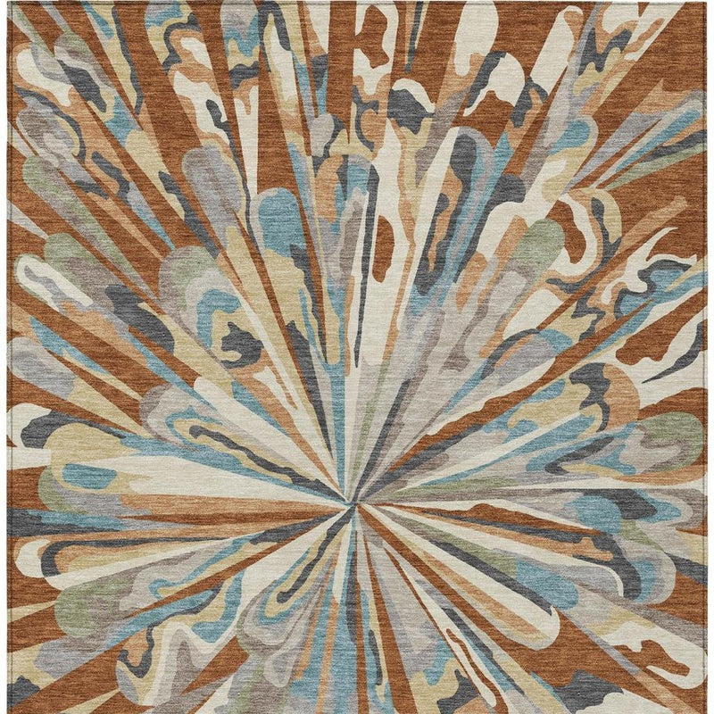 Full view abstract area rug with centered sunburst design in teal, orange, gray, and beige