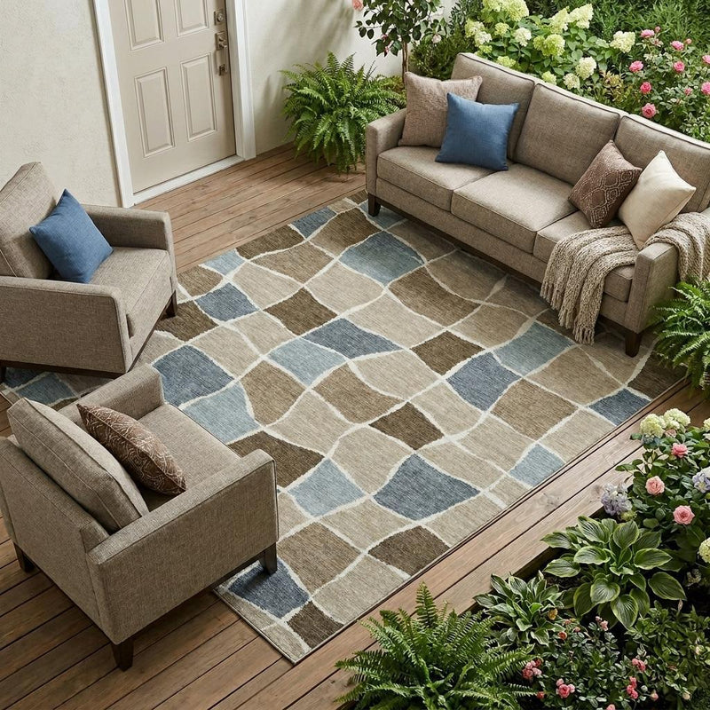 Geometric area rug with beige, brown, and light blue grid pattern on a wooden floor
