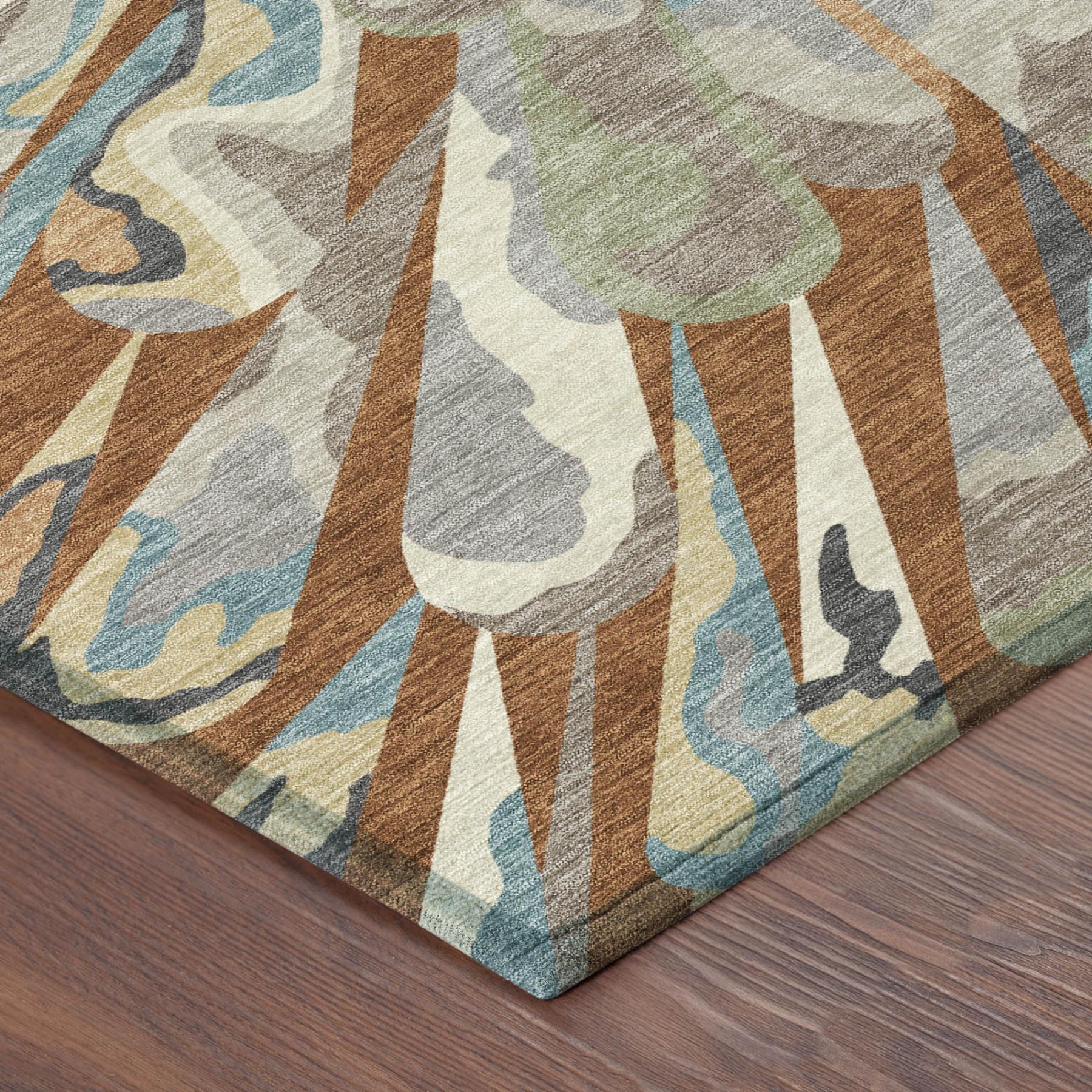 Close-up rug corner with sunburst pattern and textured weave in teal, orange, and olive-green hues