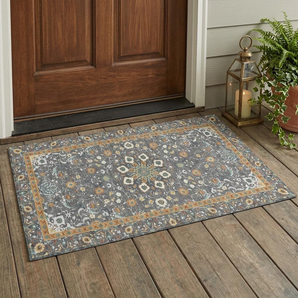 Gray oriental area rug with floral medallion border, blue and orange accents.