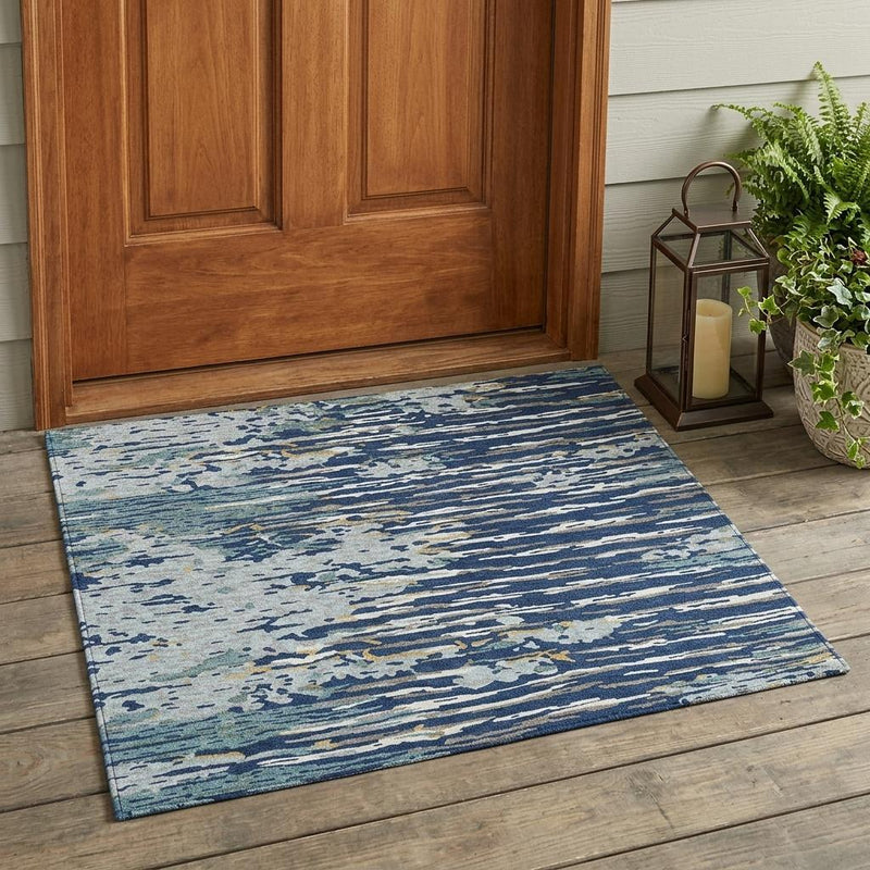 Indoor/outdoor abstract area rug in navy and light blue, flat woven look