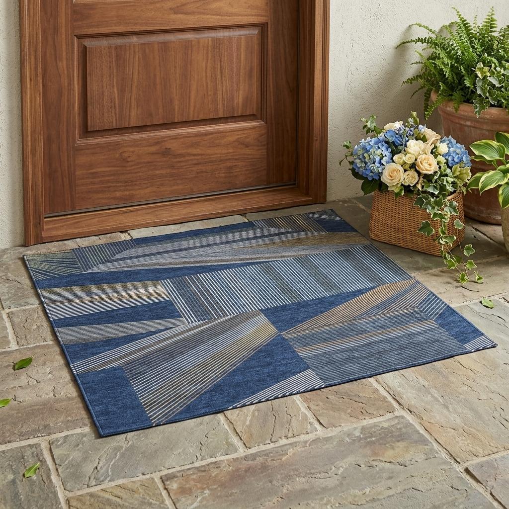 Navy and blue geometric area rug with patchwork blocks and stripe detailing