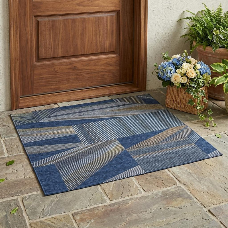 Navy and blue geometric area rug with patchwork blocks and stripe detailing