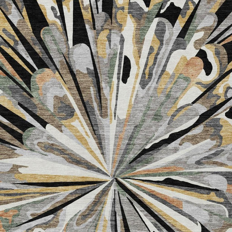 Abstract area rug detail with radial rays from center in black, gray, and warm tan hues.