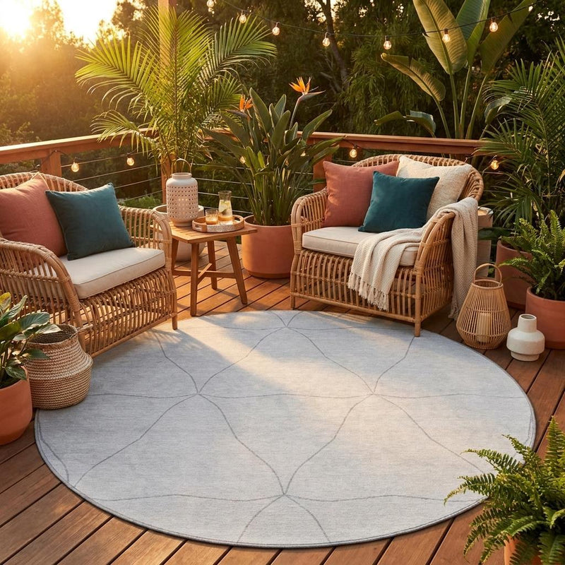 Round gray area rug with graphite geometric line pattern, washable indoor/outdoor