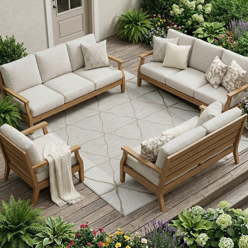Geometric ivory and taupe area rug under outdoor patio seating and chairs