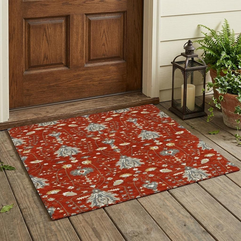 Red oriental area rug with beige and gray floral medallion pattern on wood floor