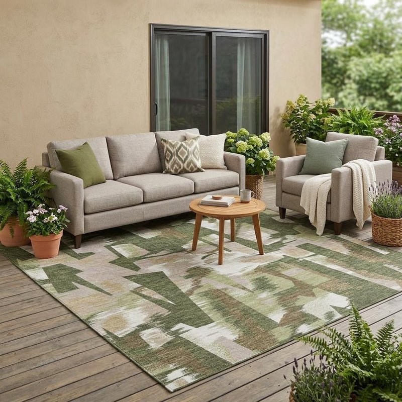 Abstract olive green area rug with off-white and beige pattern in outdoor space