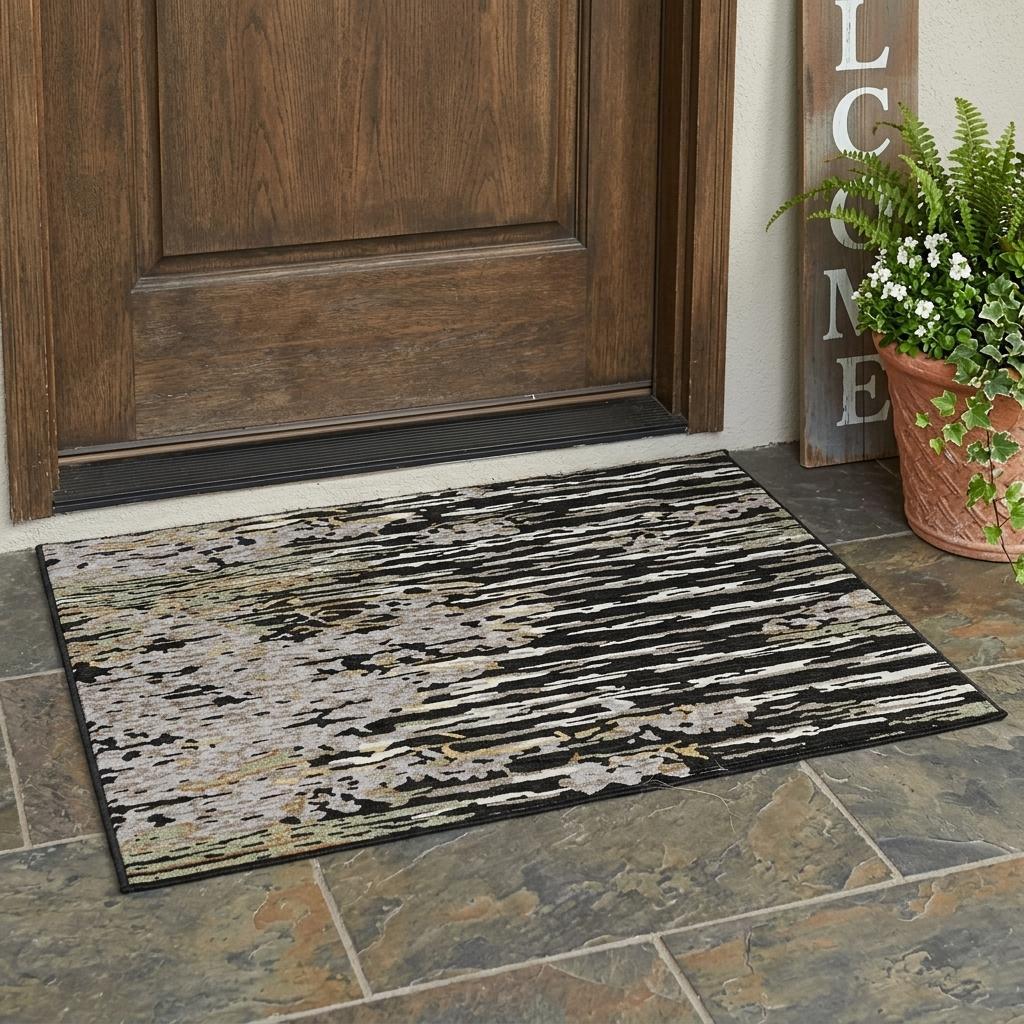 Abstract area rug on floor with black border and black/gray distressed stripe design