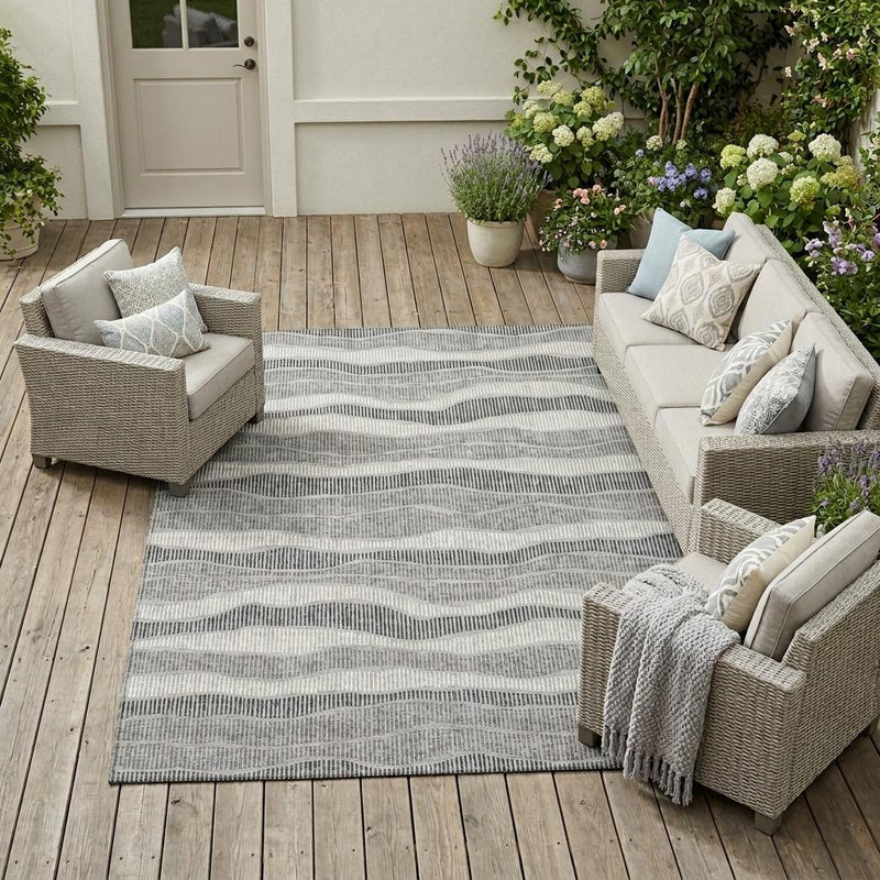 Pewter and gray wavy striped indoor outdoor area rug, rectangular