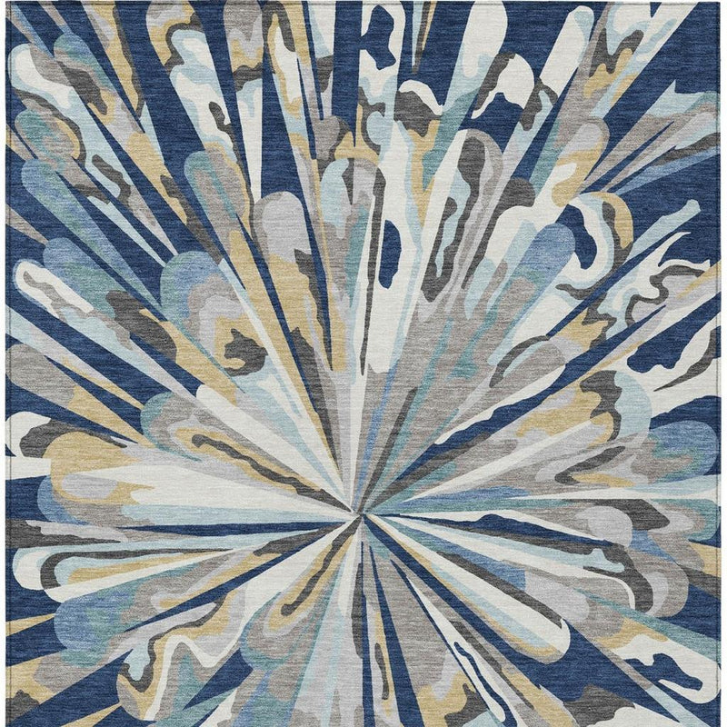 Close-up abstract rug design with navy blue radial burst and light blue accents