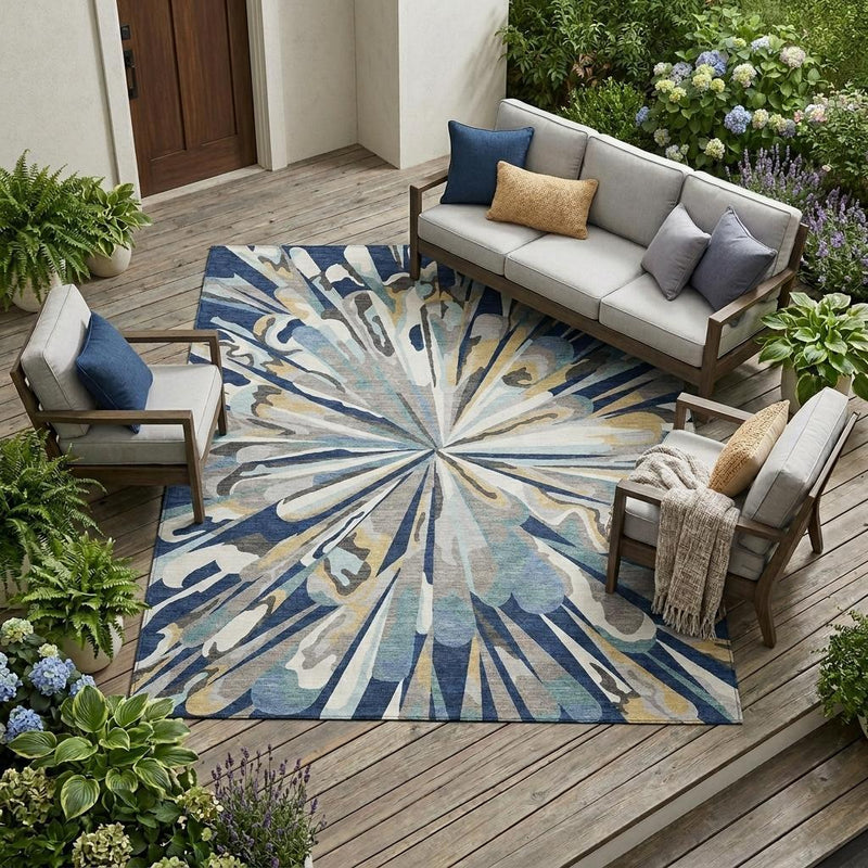 Large outdoor-ready area rug with navy blue and light blue abstract sunburst