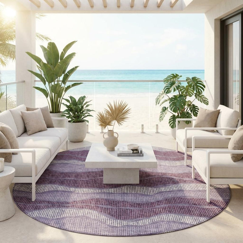 Round striped area rug with lilac and purple wavy pattern