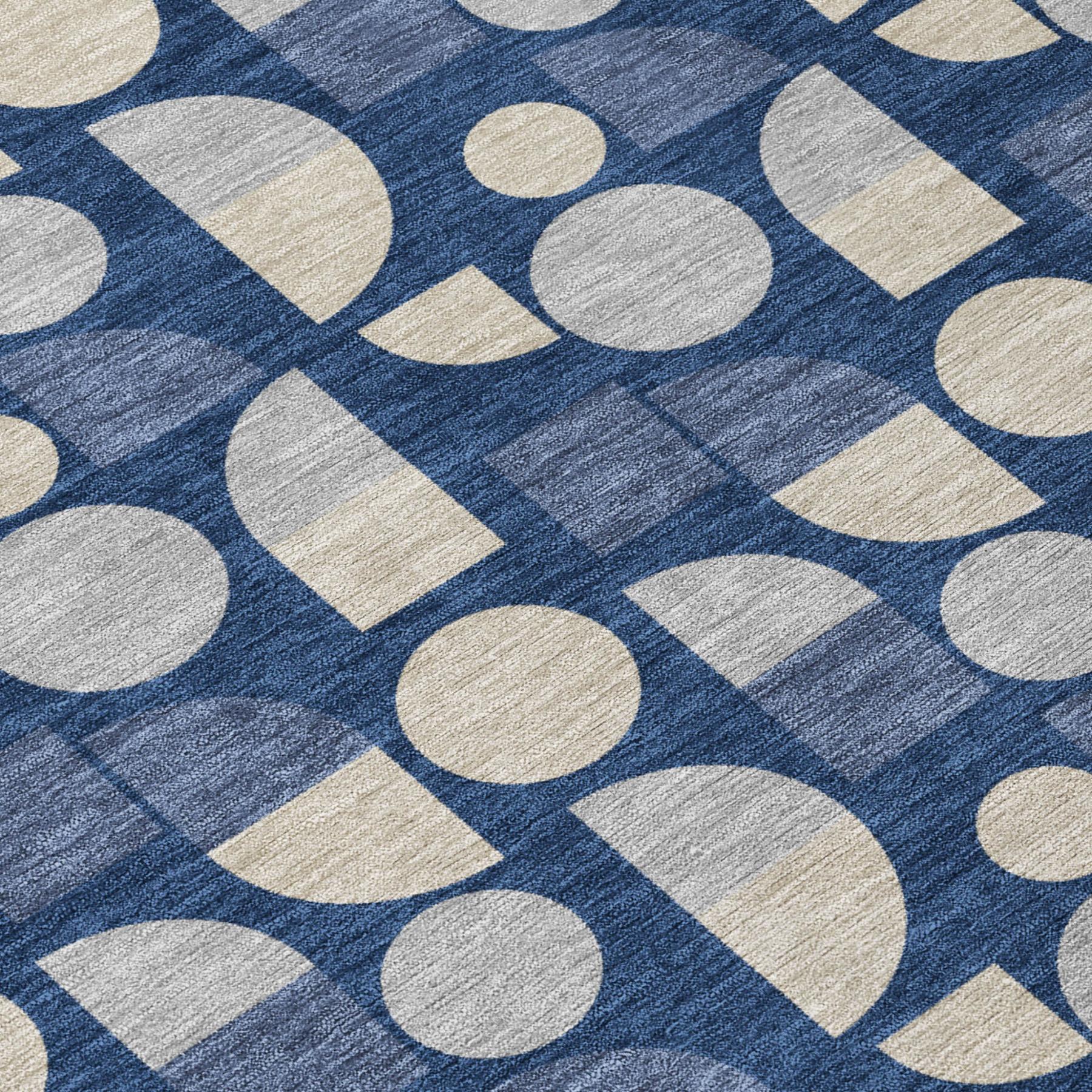 Close-up of navy blue area rug with beige circles and squares pattern