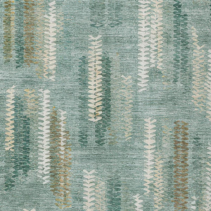 Teal rug close-up with scattered cream and tan chevron motifs