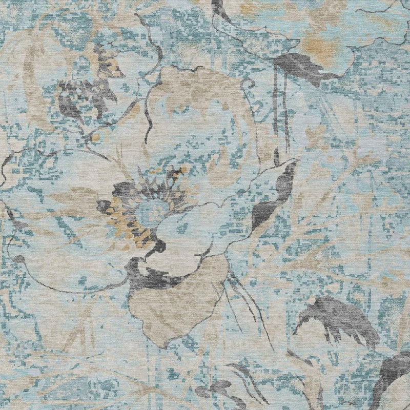 Blue and cream floral pattern on distressed area rug surface
