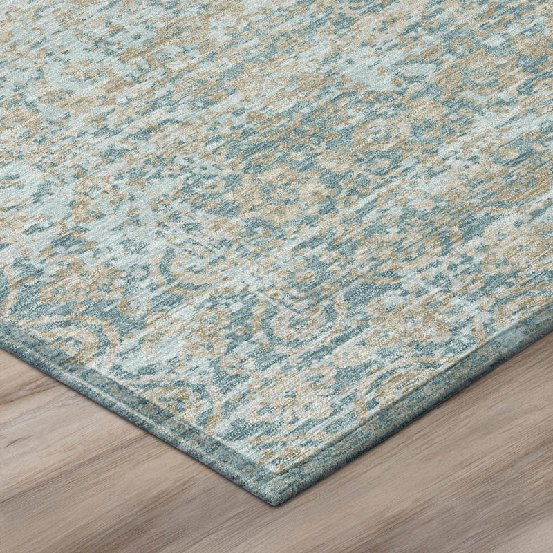Light teal blue abstract rug with silver speckled pattern and blue border edge