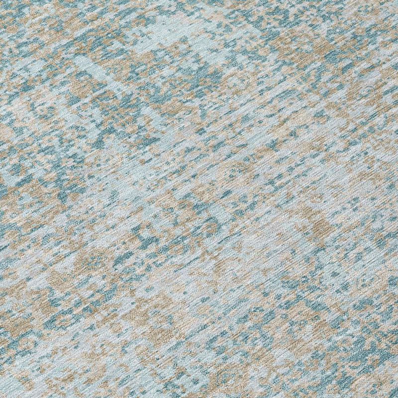 Close-up of teal blue and silver abstract distressed rug texture