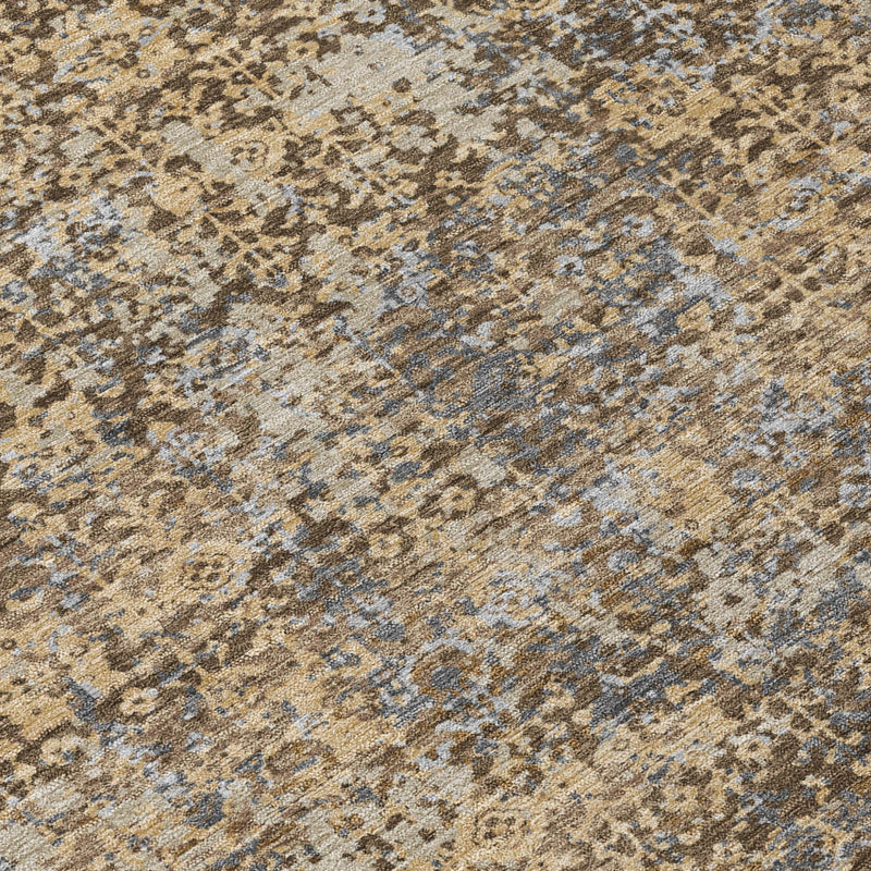 Close-up of abstract distressed rug texture in beige, tan, brown, and blue