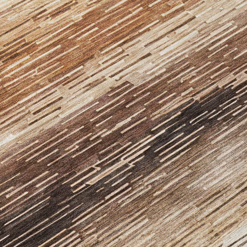 Brown and silver striped area rug close-up with distressed horizontal bands