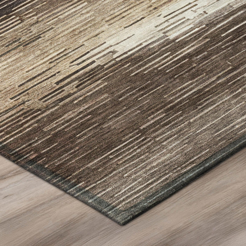 Brown and silver striped area rug corner with textured low pile and bound edge