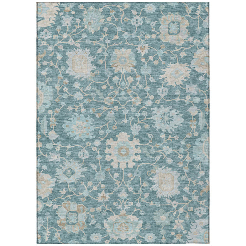 Rectangular teal blue area rug with all-over distressed cream floral pattern