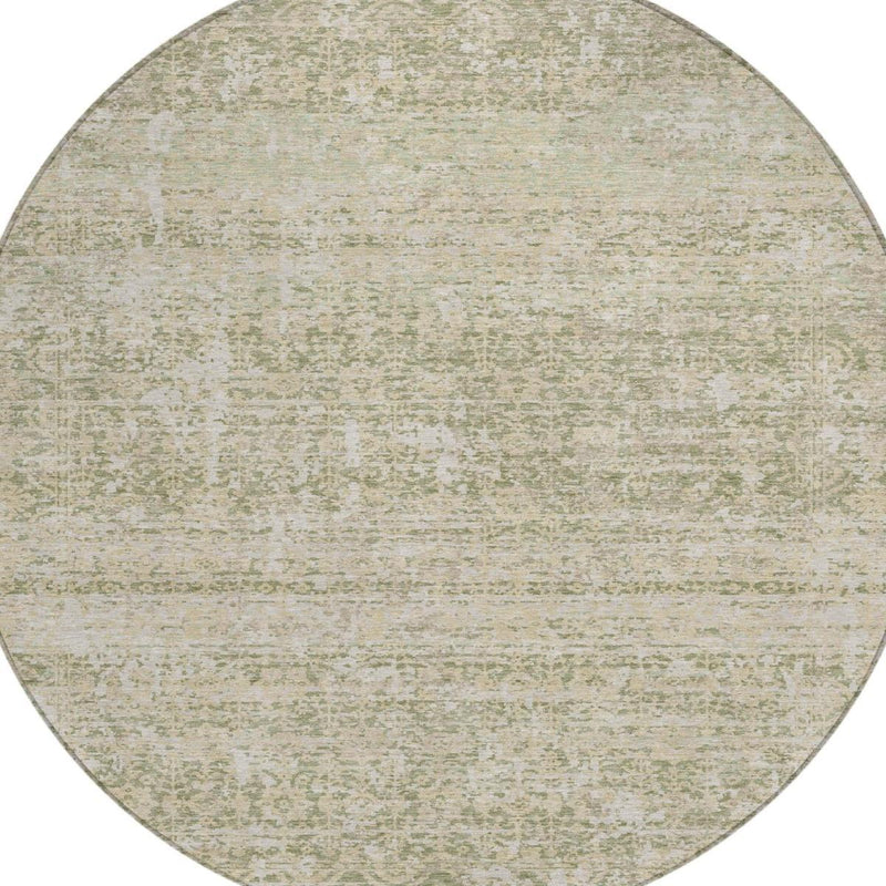 Round abstract area rug with sage green and cream mottled texture
