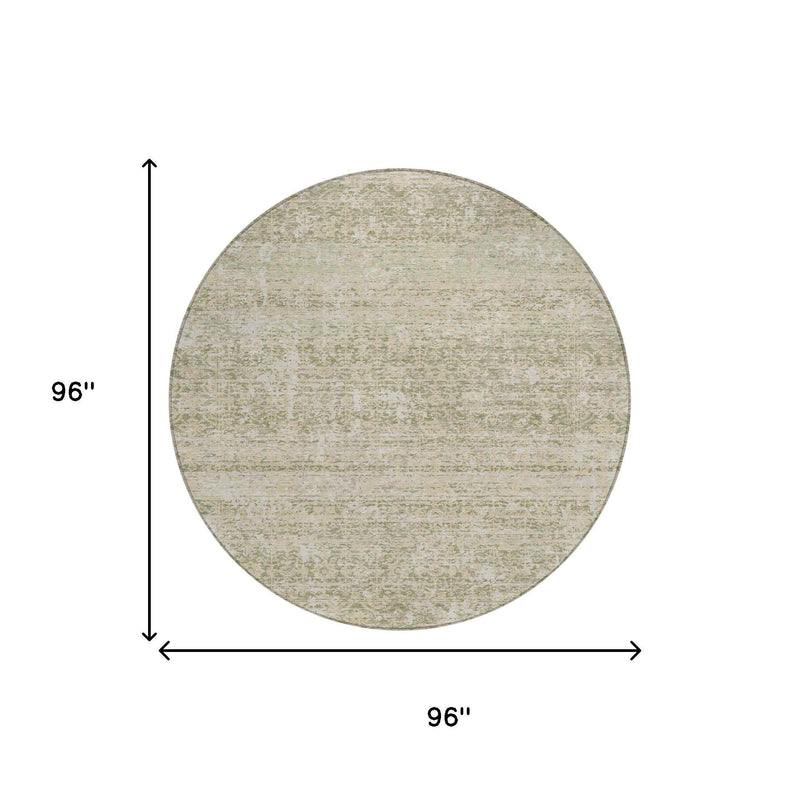 Round abstract area rug with sage green and cream mottled flat weave texture
