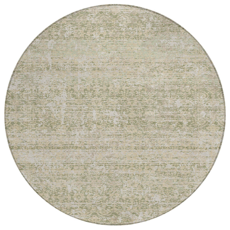 Round flat abstract rug in sage green and cream with mottled, textured finish