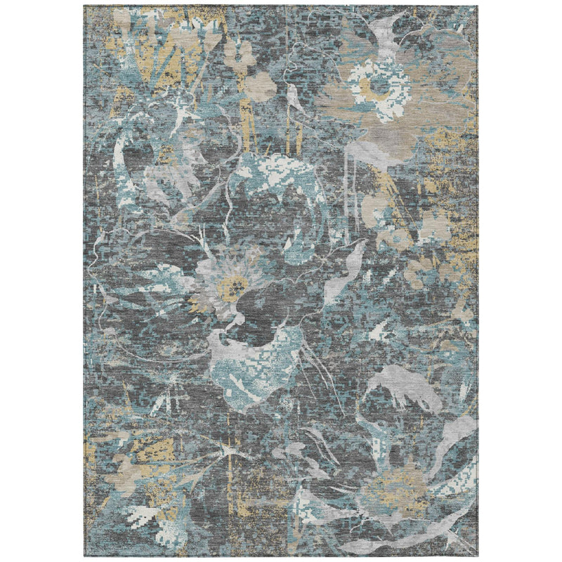 Gray area rug with abstract floral design in blue, white, and muted gold accents