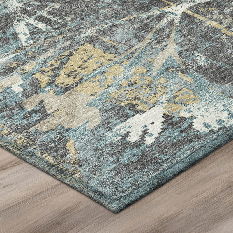 Abstract floral area rug corner in gray, blue, and white with yellow highlights