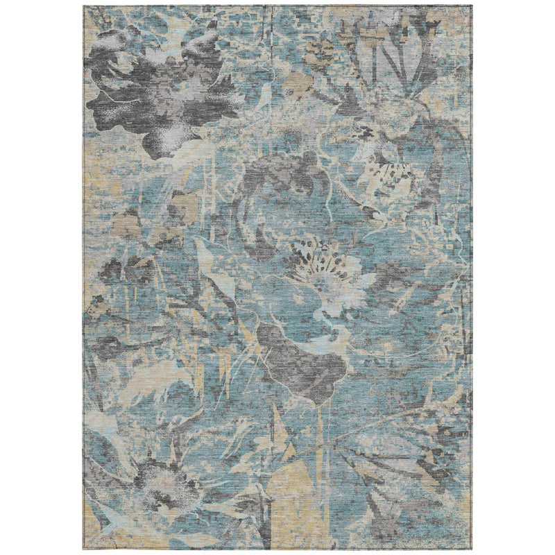 Rectangular teal-blue area rug with faded gray and silver floral-and-branch pattern