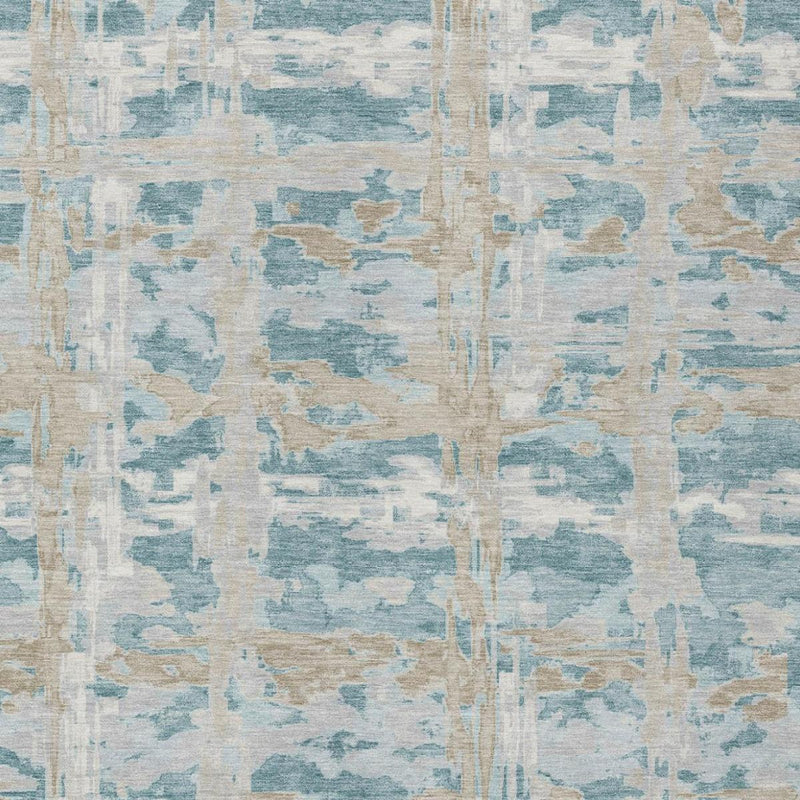Abstract rug surface detail with teal blue, silver, and cream mottled distressed pattern
