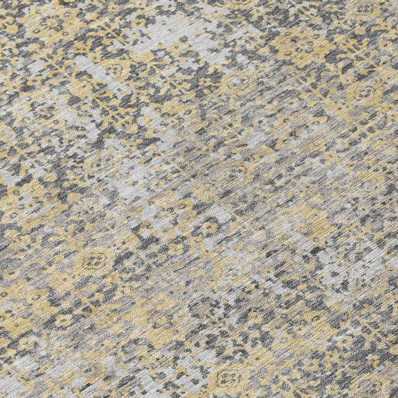 Close-up of gray and beige abstract area rug with mottled distressed texture