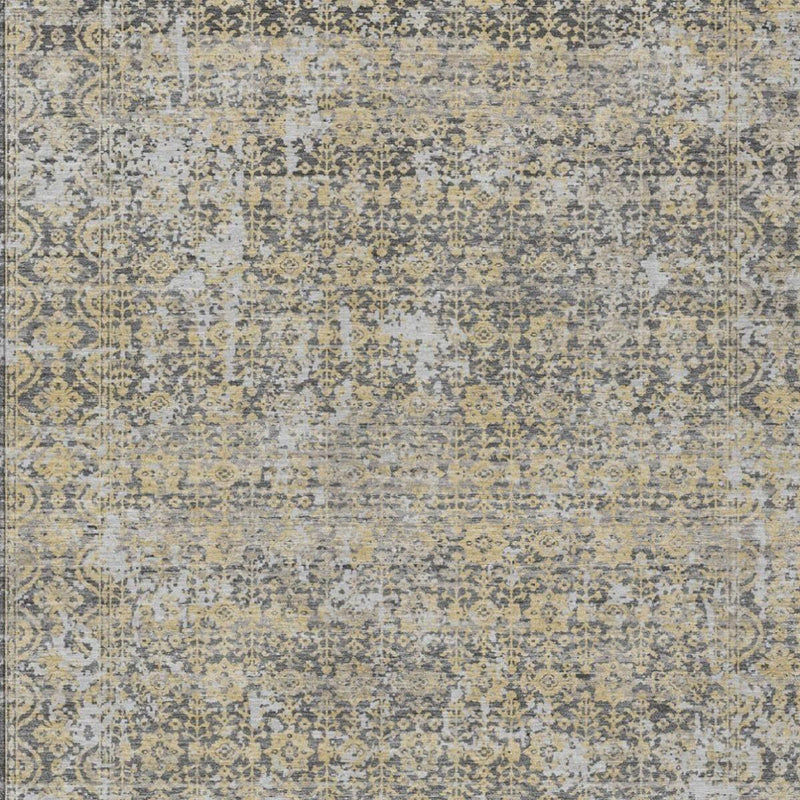 Gray and beige abstract area rug with mottled distressed finish and decorative motif