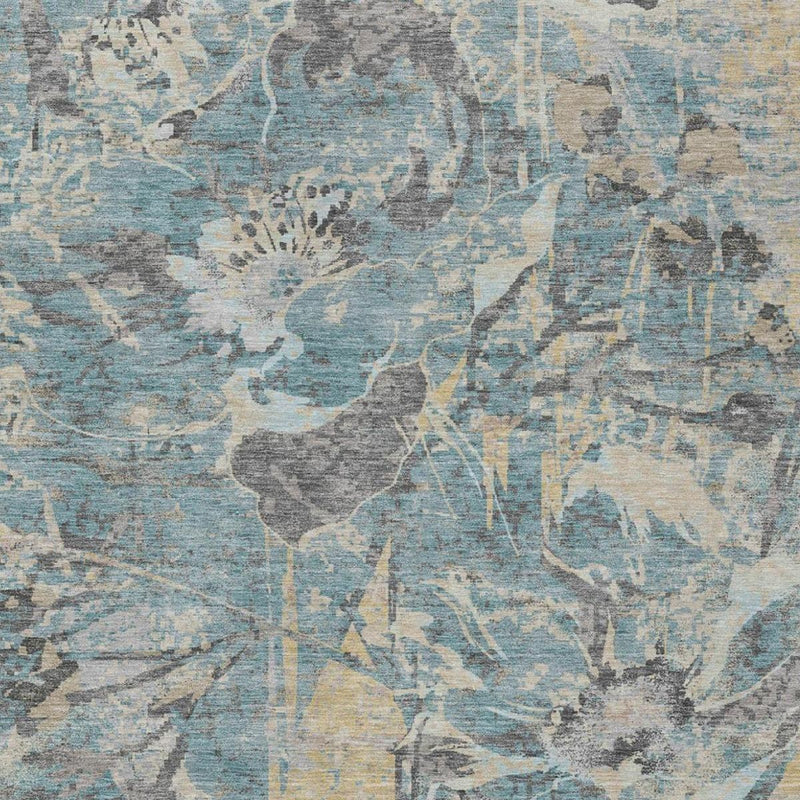 Teal and silver floral area rug close-up with gray leaf shapes and speckling