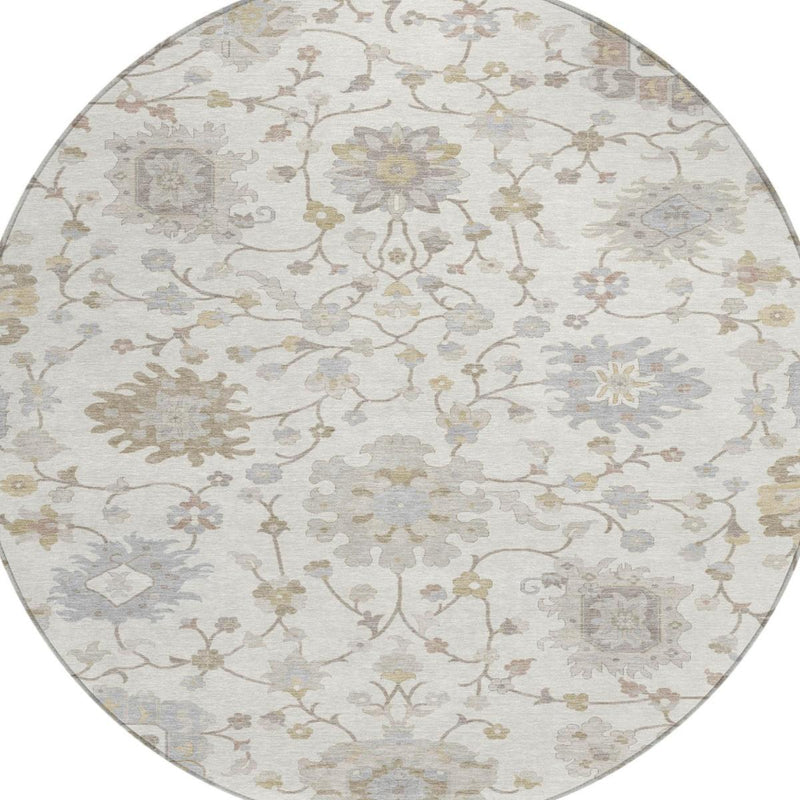 Round area rug with ivory base and scattered floral motifs, full center view