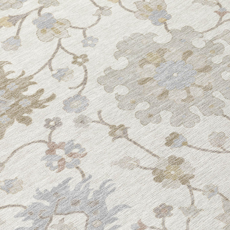 Close-up of round rug fabric showing detailed floral vine pattern in muted tones
