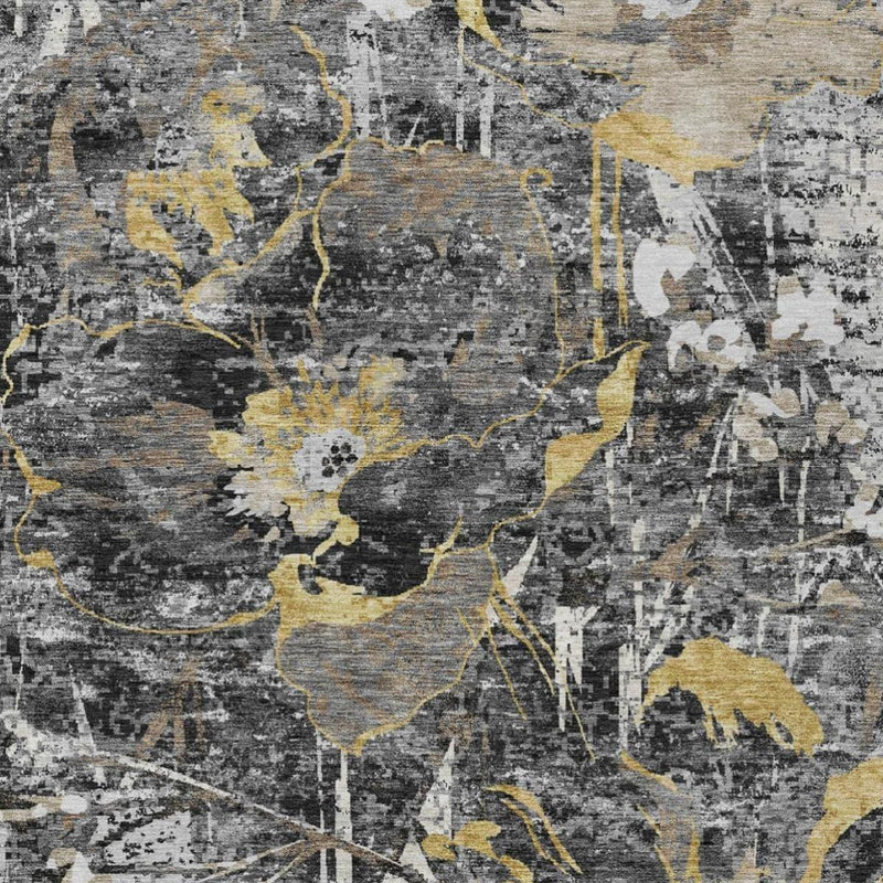 Close-up of black, gray, and ivory abstract floral pattern with gold accents