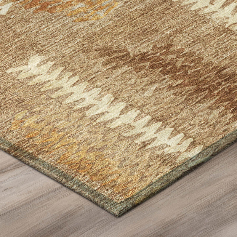 Corner view of tan abstract area rug with woven texture and orange copper accents