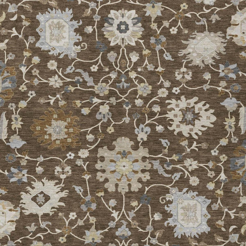 Brown area rug with all-over cream, light blue, and gold floral motif pattern