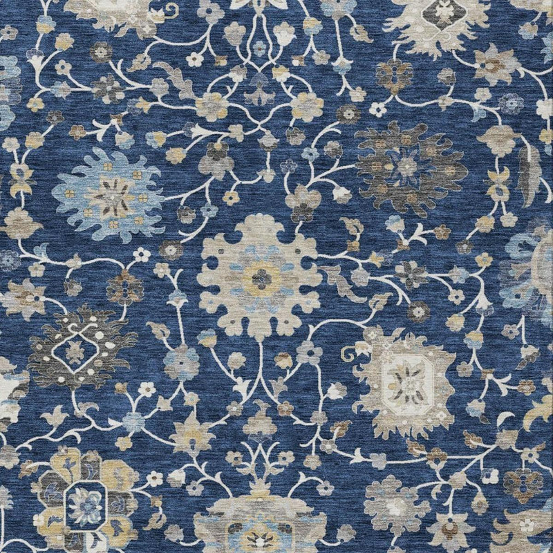 Navy blue floral area rug close-up with light beige and white medallion blossoms
