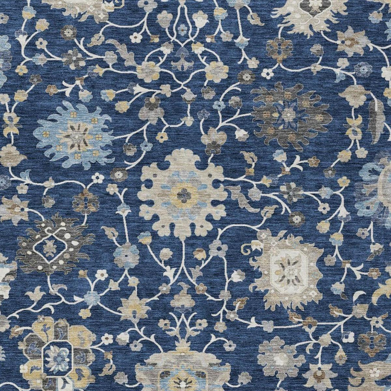 Overhead view of navy floral area rug with white vine network and beige flower clusters