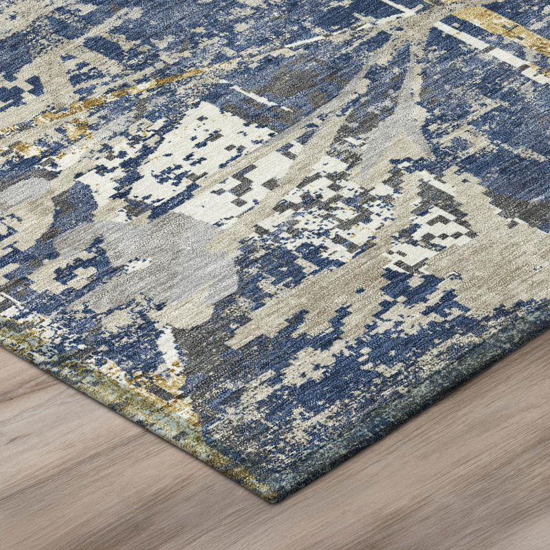 Navy and cream area rug with distressed floral motifs and textured flat weave