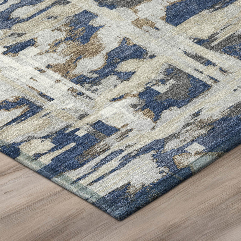 Navy and blue abstract area rug corner detail with distressed pattern and border