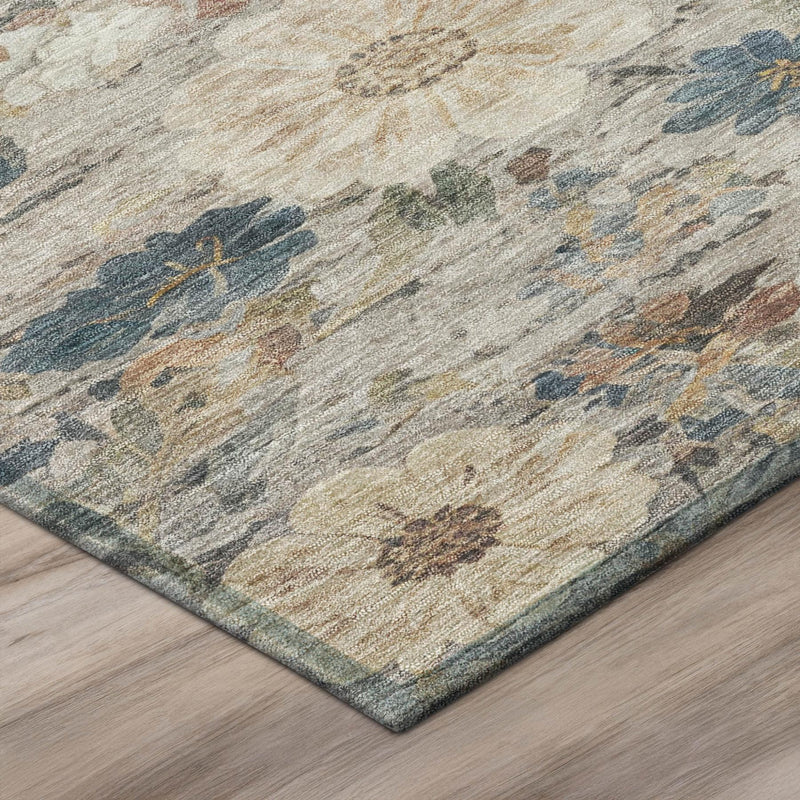 Corner view of round washable area rug with blue floral details on ivory fabric